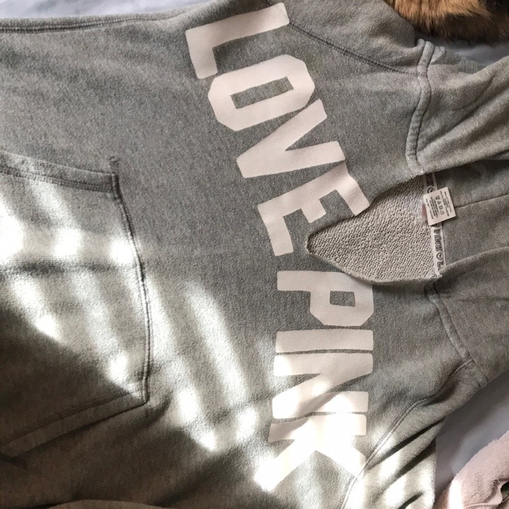 “pink” grey and white hooded sweatshirt.